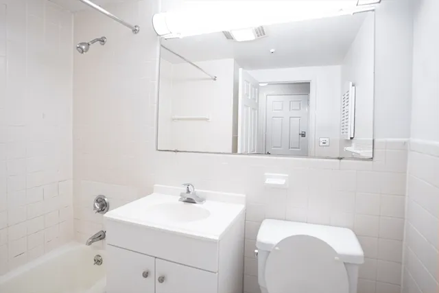 a bathroom with a toilet and a sink