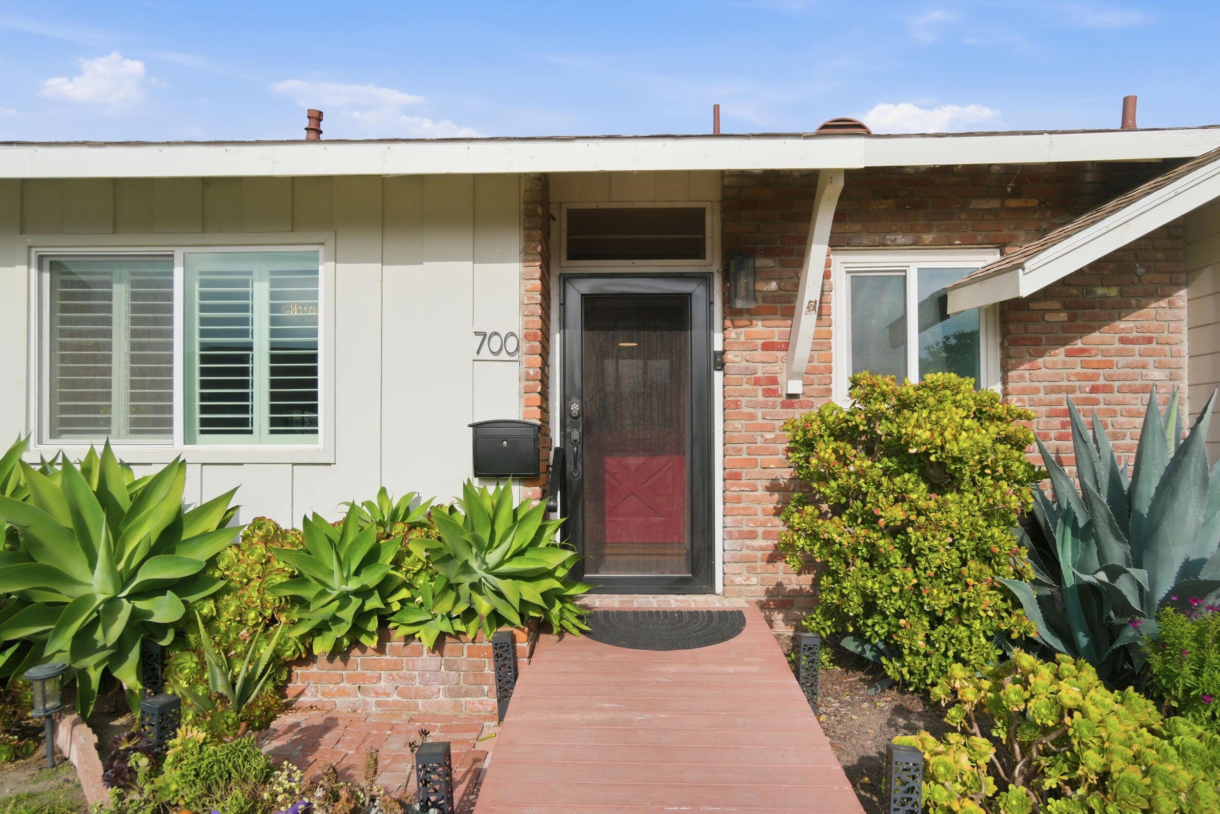 700 North M Street Oxnard, CA 93030 - Photo 2 of 35 a front view of a house with a yard