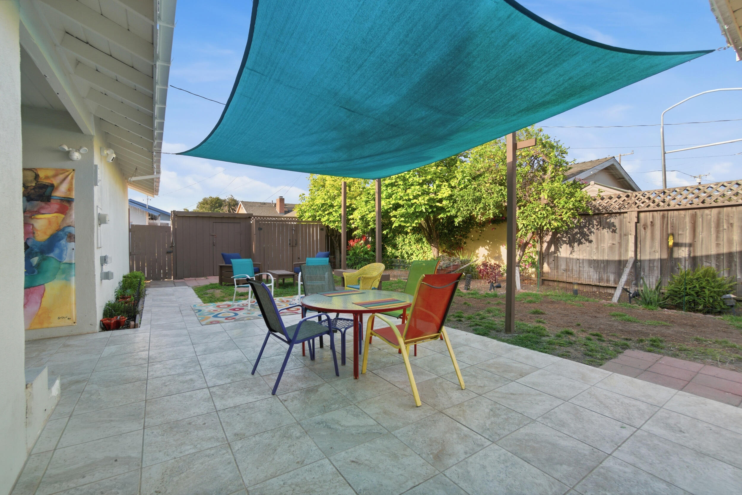 700 North M Street Oxnard, CA 93030 - Photo 25 of 35 a patio with a table and chairs and potted plants