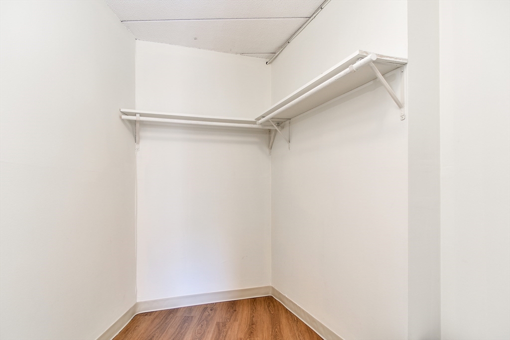 147 Turner Road, Unit 106 Holliston, MA 01746 - Photo 11 of 16 a view of walk in closet with clothes