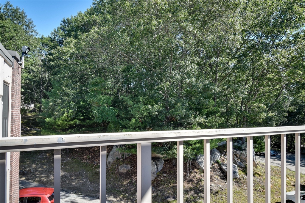 147 Turner Road, Unit 106 Holliston, MA 01746 - Photo 12 of 16 a view of a balcony with an outdoor space
