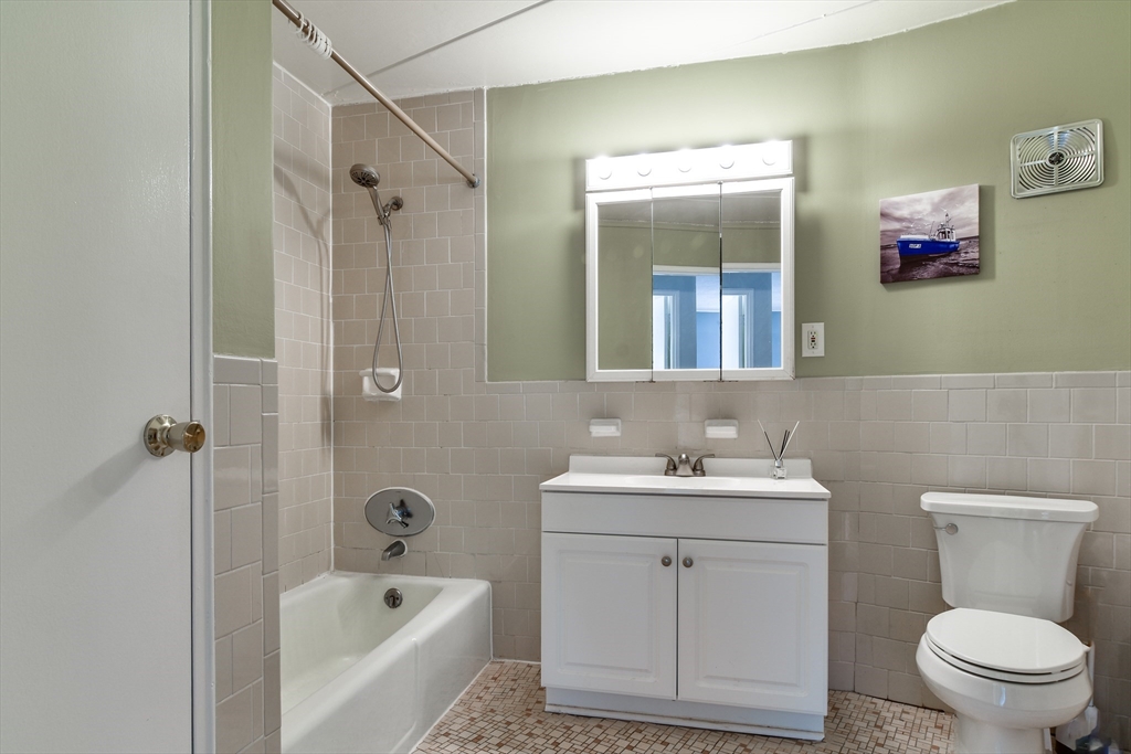 147 Turner Road, Unit 106 Holliston, MA 01746 - Photo 13 of 16 a bathroom with a sink toilet and shower