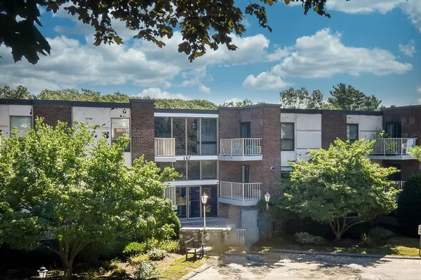 a view of a building with a garden