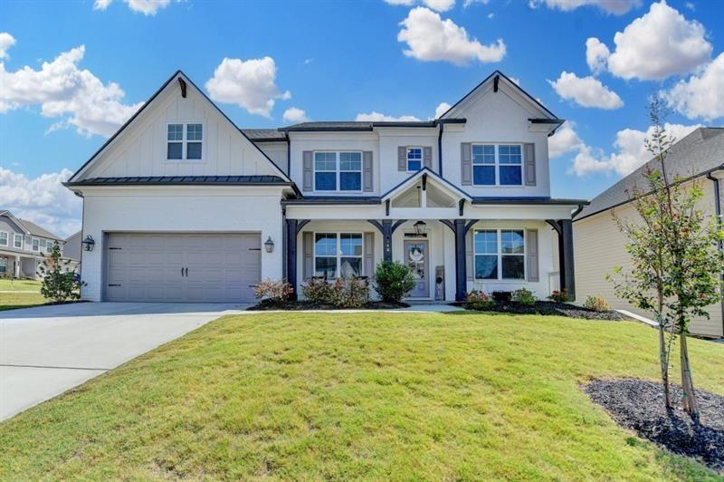 148 Logan Pass Drive Loganville, GA 30052 - Photo 1 of 103 a front view of a house with a yard and garage