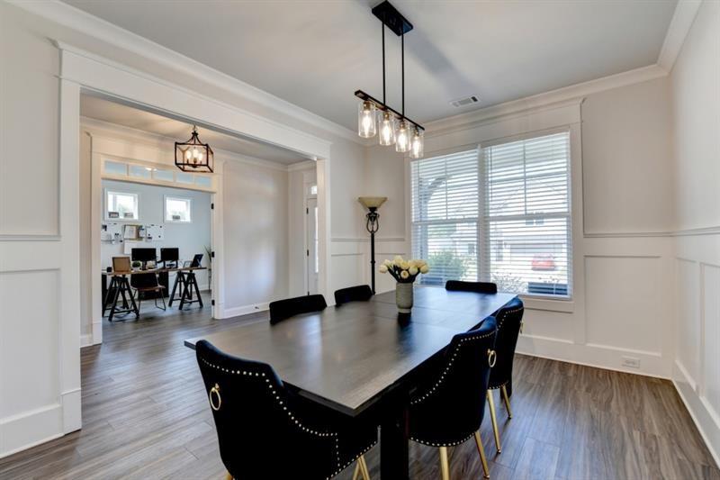 148 Logan Pass Drive Loganville, GA 30052 - Photo 15 of 103 a view of a dining room with furniture and wooden floor