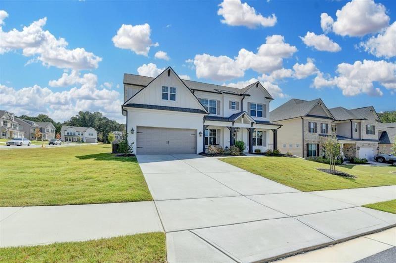 148 Logan Pass Drive Loganville, GA 30052 - Photo 2 of 103 a front view of a house with garden