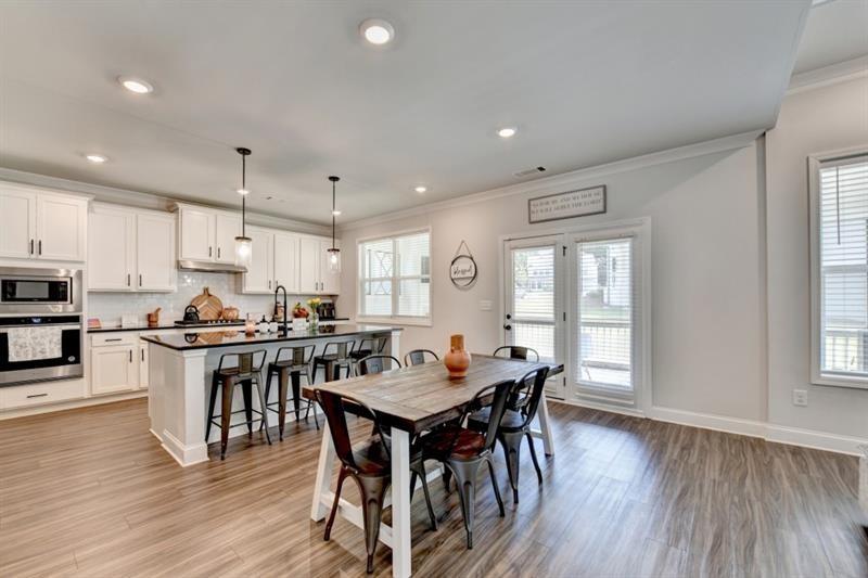 148 Logan Pass Drive Loganville, GA 30052 - Photo 26 of 103 a view of a dining room with furniture window and wooden floor