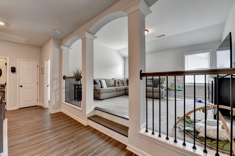 148 Logan Pass Drive Loganville, GA 30052 - Photo 45 of 103 a view of a balcony with wooden floor