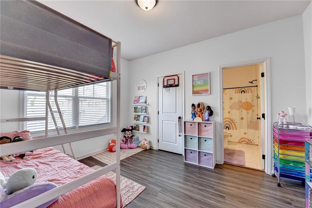 148 Logan Pass Drive Loganville, GA 30052 - Photo 53 of 103 a bedroom with bed and a wooden floor