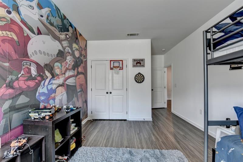 148 Logan Pass Drive Loganville, GA 30052 - Photo 55 of 103 a view of livingroom with furniture and wooden floor