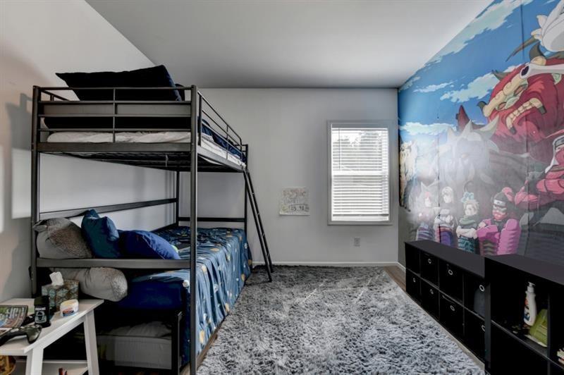 148 Logan Pass Drive Loganville, GA 30052 - Photo 59 of 103 a bedroom with a bed and a window