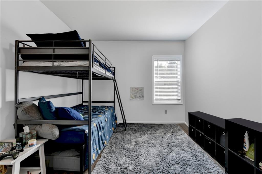 148 Logan Pass Drive Loganville, GA 30052 - Photo 60 of 103 a bedroom with a bed and a window