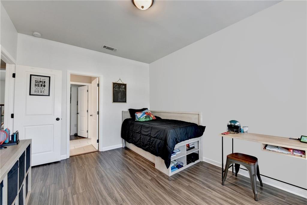 148 Logan Pass Drive Loganville, GA 30052 - Photo 65 of 103 a living room with a bed furniture and a window