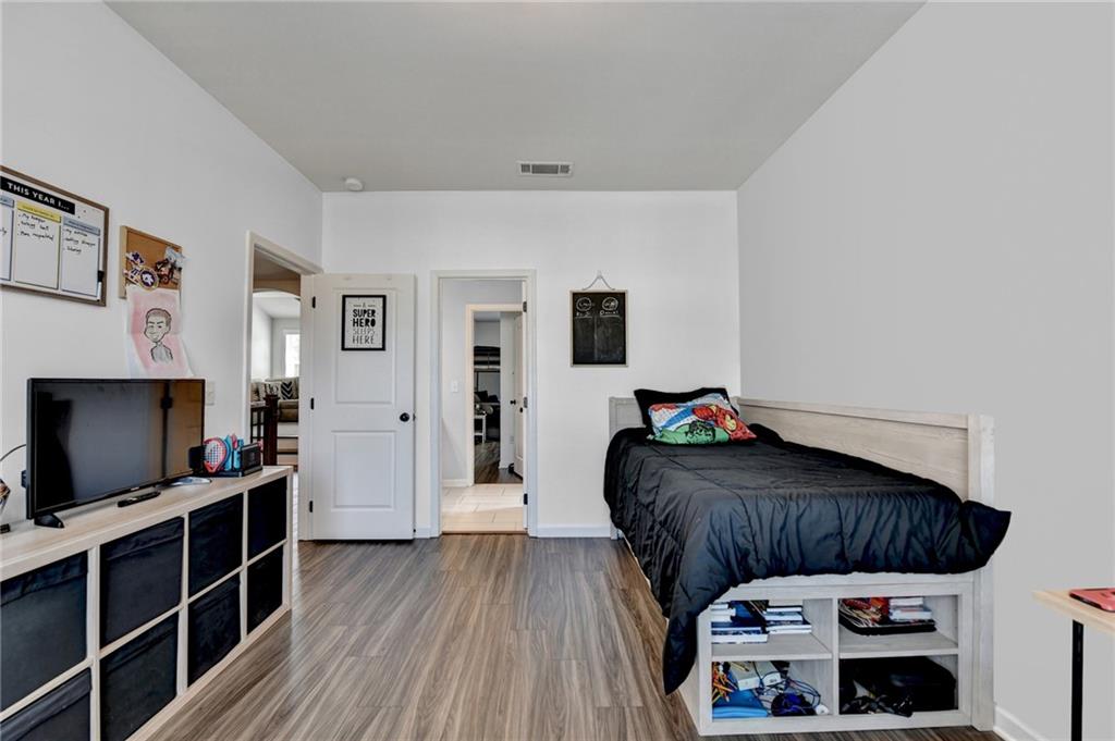 148 Logan Pass Drive Loganville, GA 30052 - Photo 67 of 103 a living room with furniture and a flat screen tv