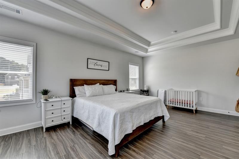 148 Logan Pass Drive Loganville, GA 30052 - Photo 72 of 103 a bedroom with a bed and a dresser