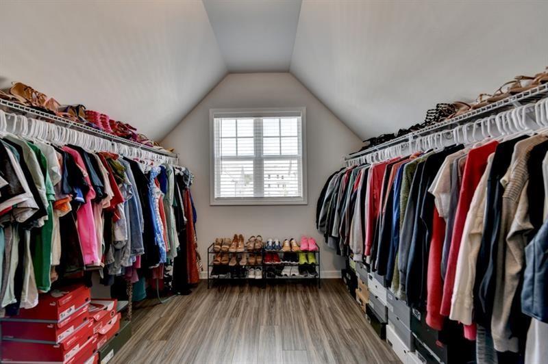 148 Logan Pass Drive Loganville, GA 30052 - Photo 80 of 103 a view of walk in closet with clothes and shoes