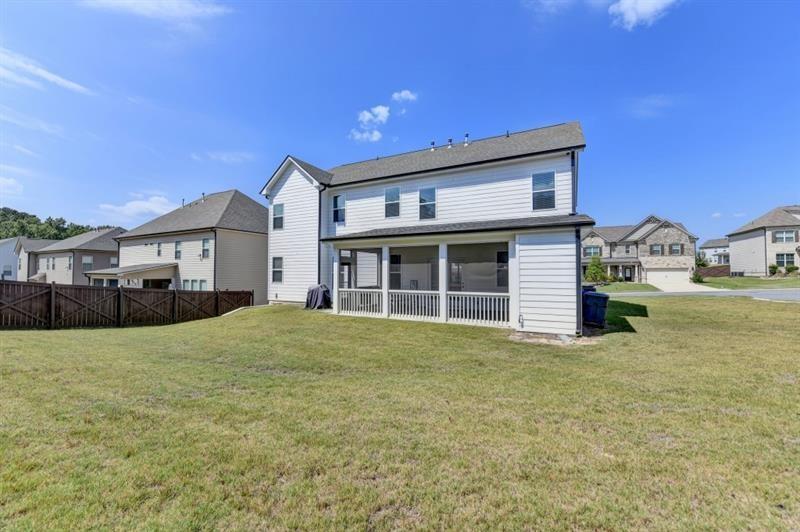 148 Logan Pass Drive Loganville, GA 30052 - Photo 86 of 103 a front view of a house with a garden