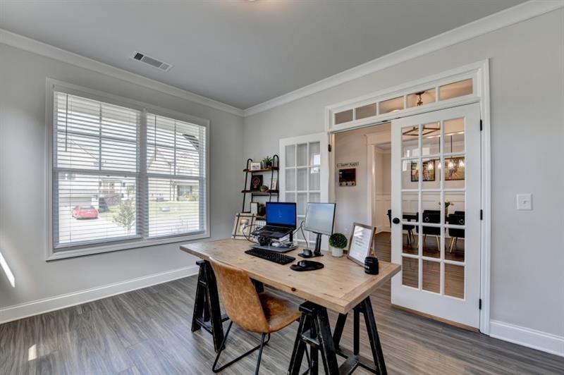 148 Logan Pass Drive Loganville, GA 30052 - Photo 9 of 103 a view of a dining room with furniture window and wooden floor