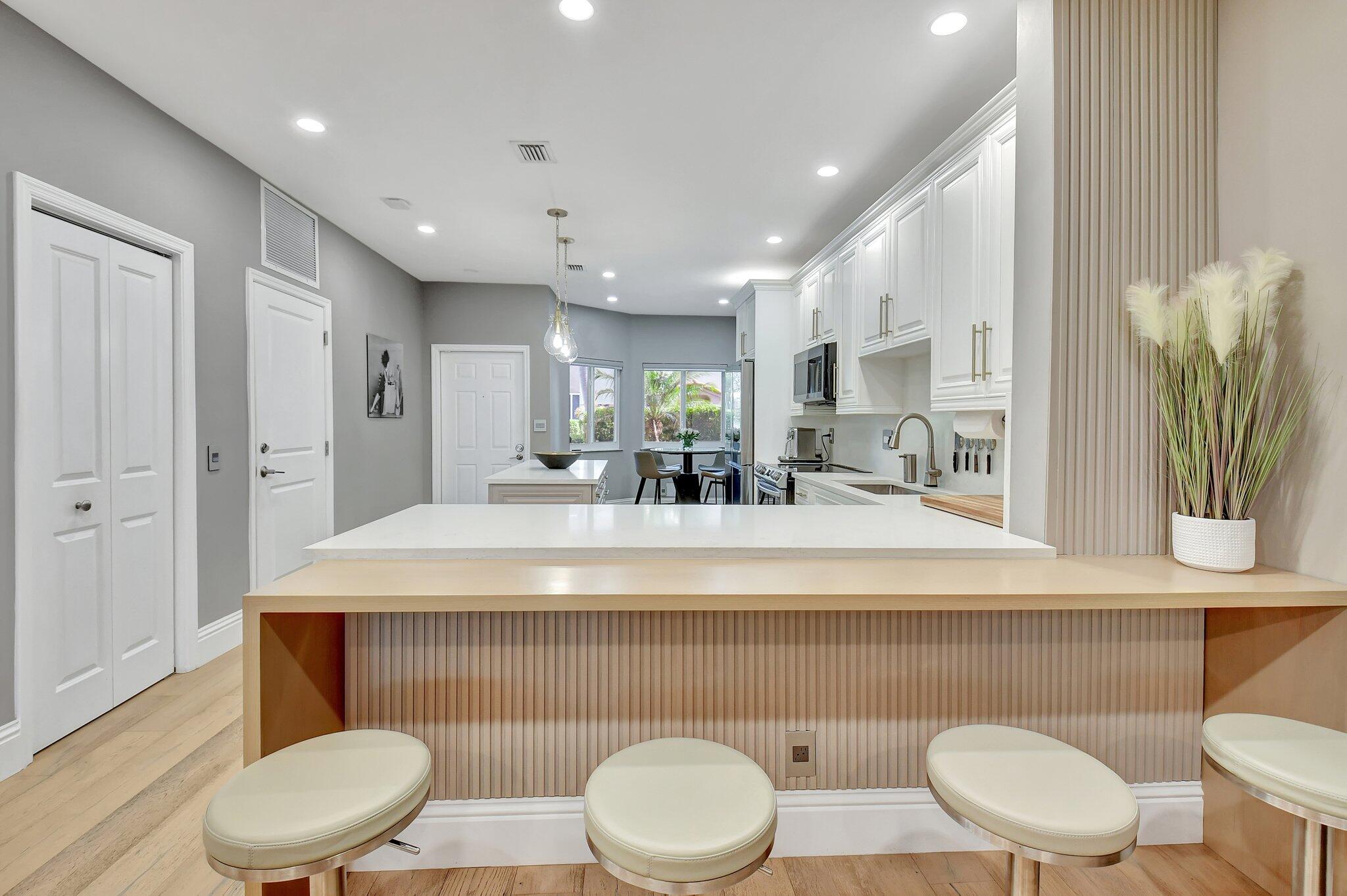 6795 Via Regina Boca Raton, FL 33433 - Photo 14 of 83 a bathroom with a toilet a sink and a mirror