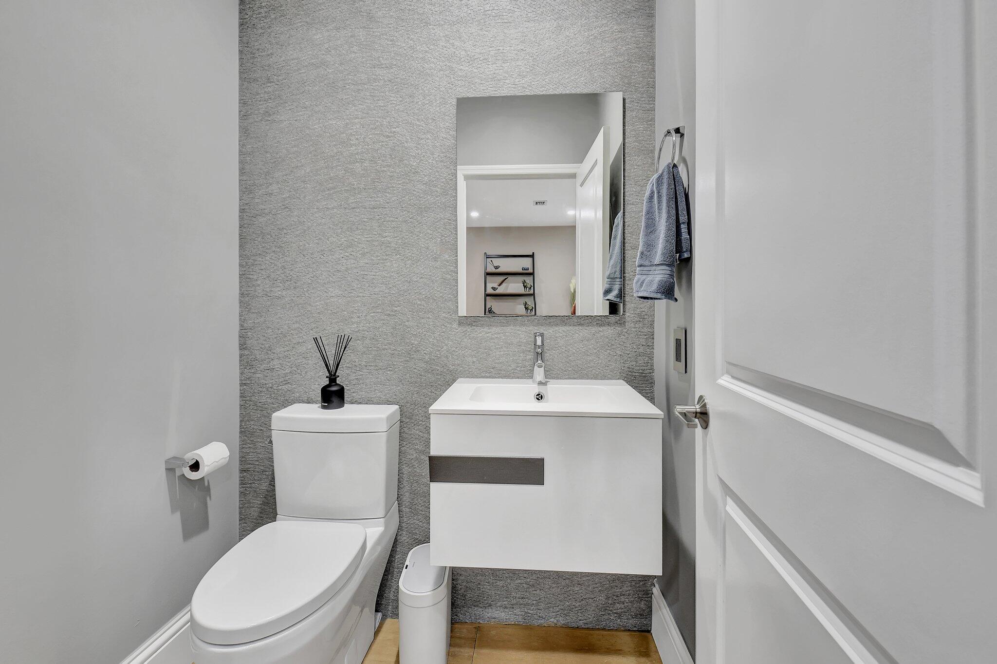 6795 Via Regina Boca Raton, FL 33433 - Photo 16 of 83 a bathroom with a sink toilet and mirror