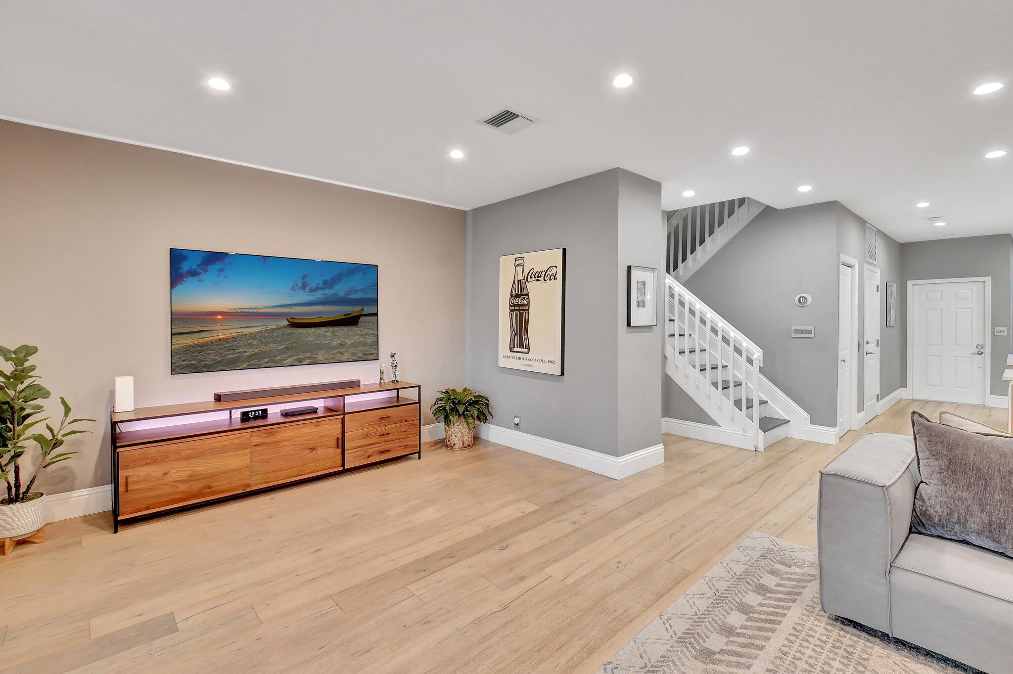 6795 Via Regina Boca Raton, FL 33433 - Photo 18 of 83 a living room with furniture and a flat screen tv