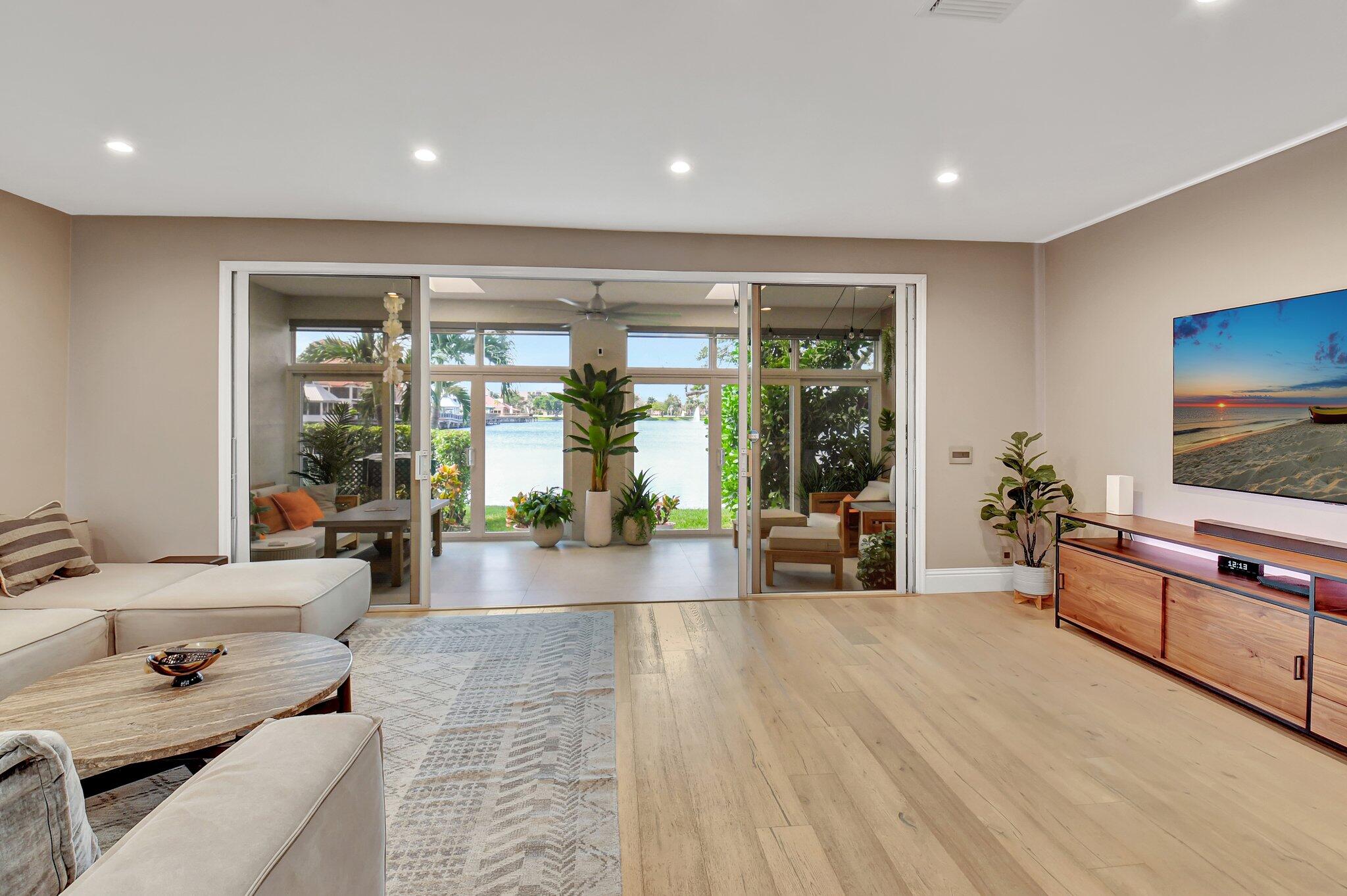 6795 Via Regina Boca Raton, FL 33433 - Photo 19 of 83 a living room with furniture and a flat screen tv