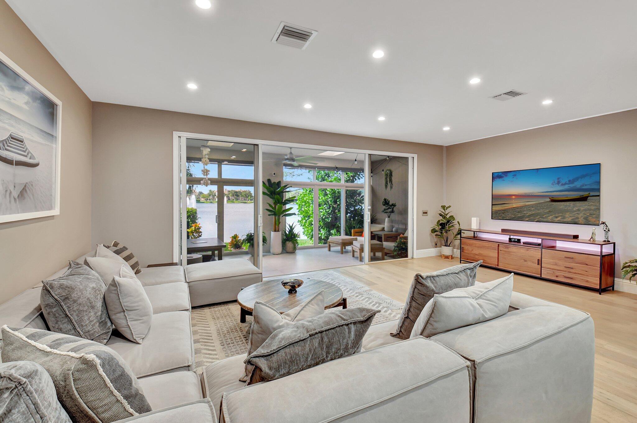 6795 Via Regina Boca Raton, FL 33433 - Photo 21 of 83 a living room with furniture and a flat screen tv