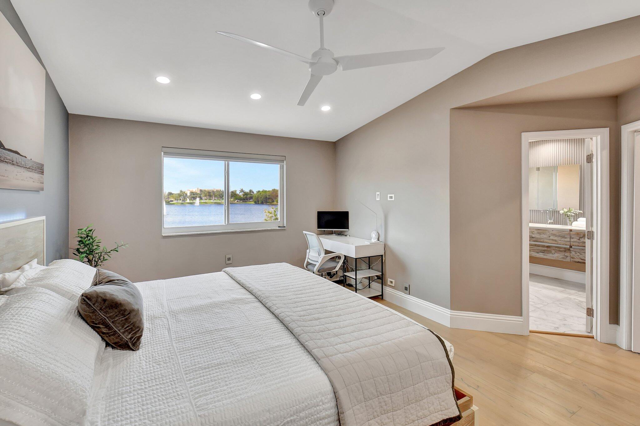 6795 Via Regina Boca Raton, FL 33433 - Photo 28 of 83 a bedroom with a large bed and a window