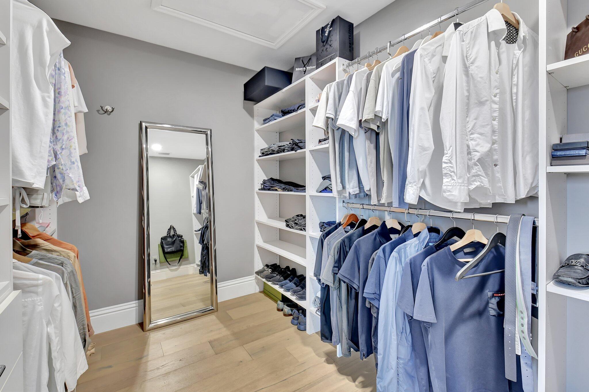 6795 Via Regina Boca Raton, FL 33433 - Photo 34 of 83 a view of walk in closet with clothes and shoes