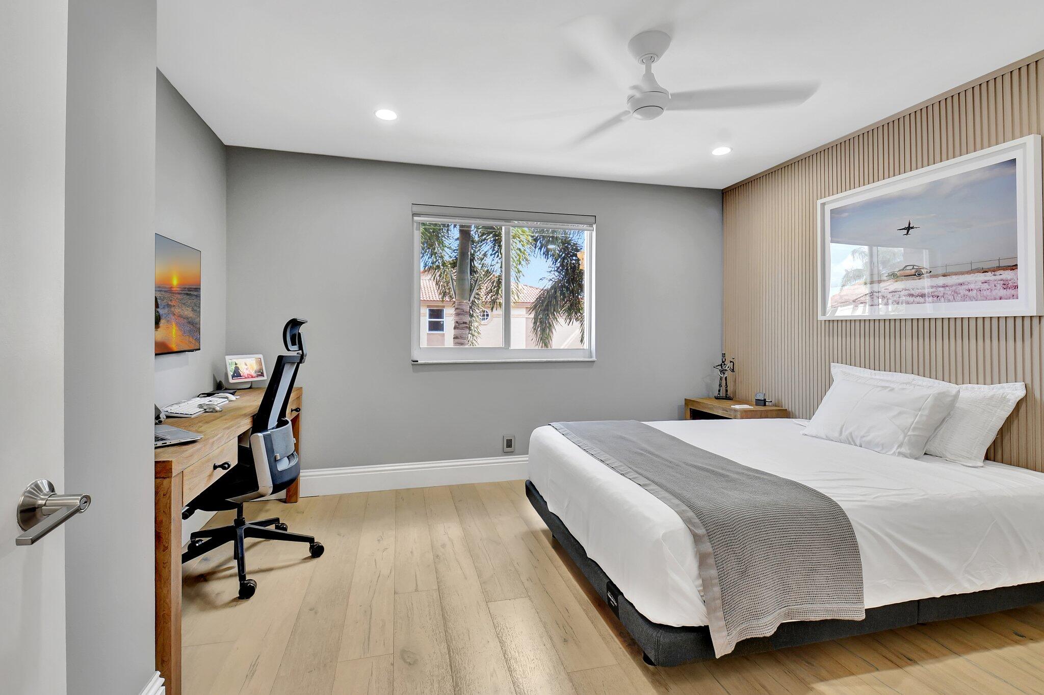 6795 Via Regina Boca Raton, FL 33433 - Photo 41 of 83 a bedroom with a bed a desk and chair