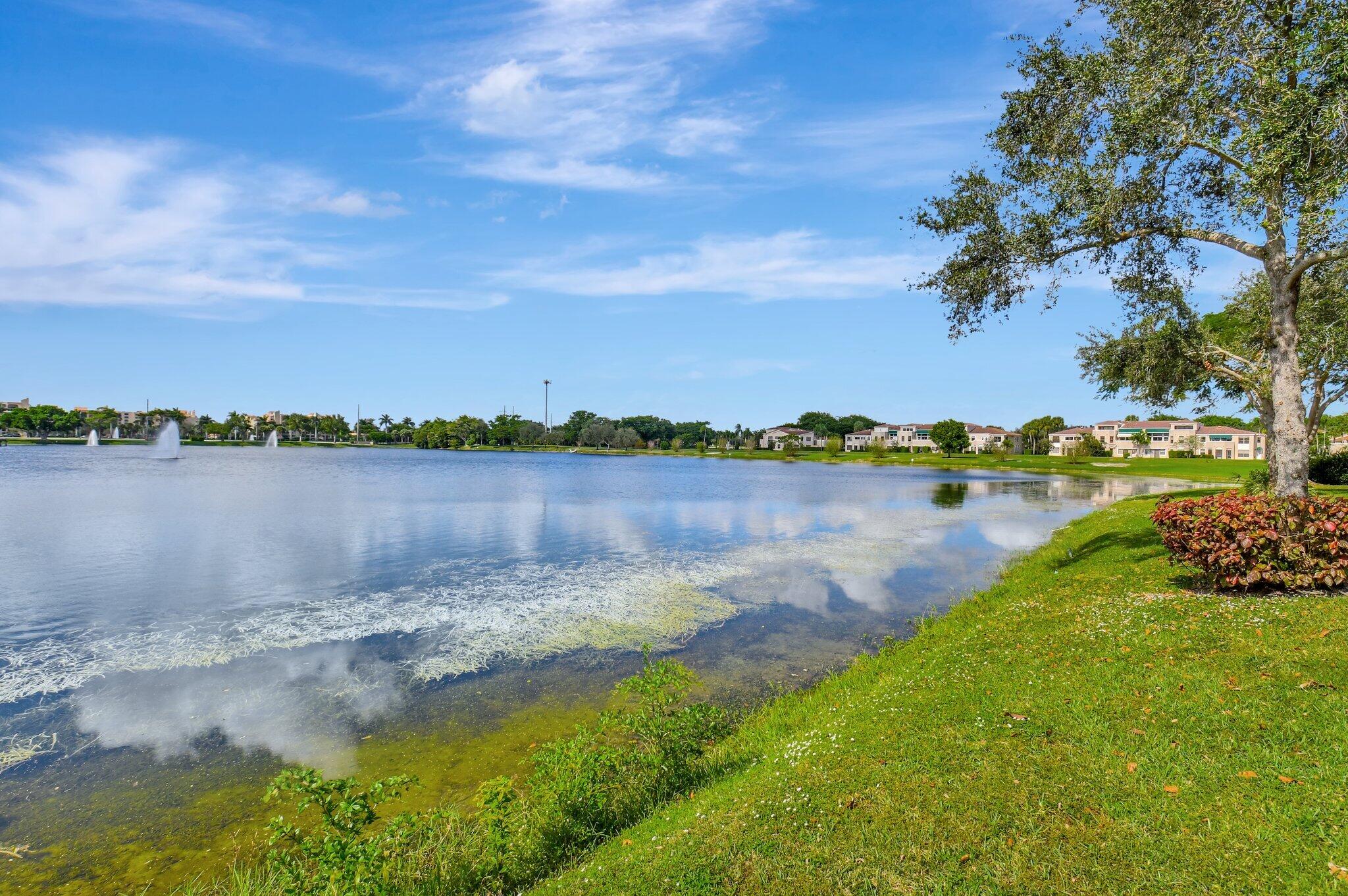 6795 Via Regina Boca Raton, FL 33433 - Photo 46 of 83 a view of a lake with houses in the back