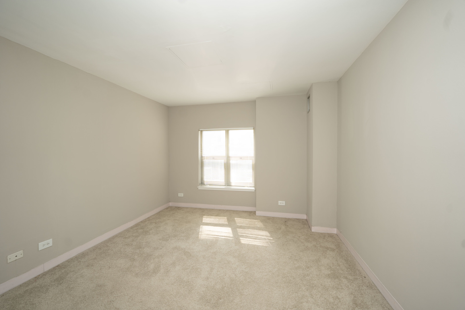 100 West Chestnut Street, Unit 2505 Chicago, IL 60610 - Photo 12 of 13 an empty room with a window