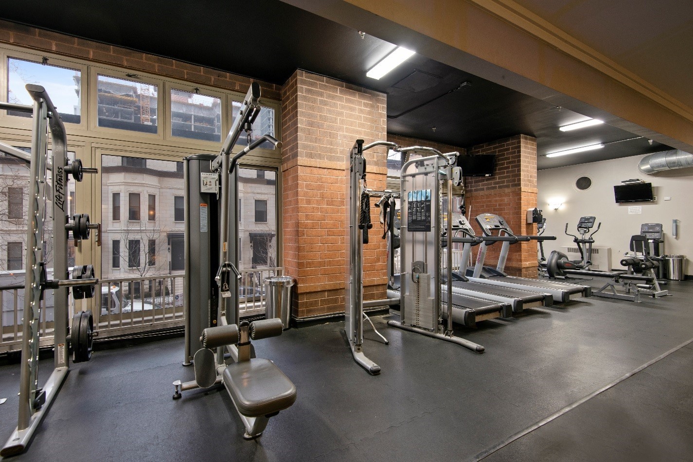 100 West Chestnut Street, Unit 2505 Chicago, IL 60610 - Photo 2 of 13 a view of a room with gym equipment