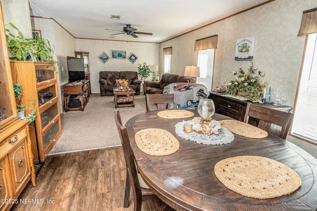 a bathroom with a granite countertop sink and a toilet