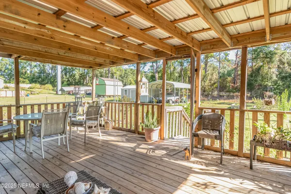 a balcony with furniture and wooden floor