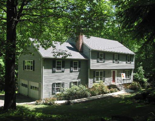 118 Sleepy Hollow Road Ridgefield, CT 06877 - Photo 1 of 1 a front view of a house with a garden and porch