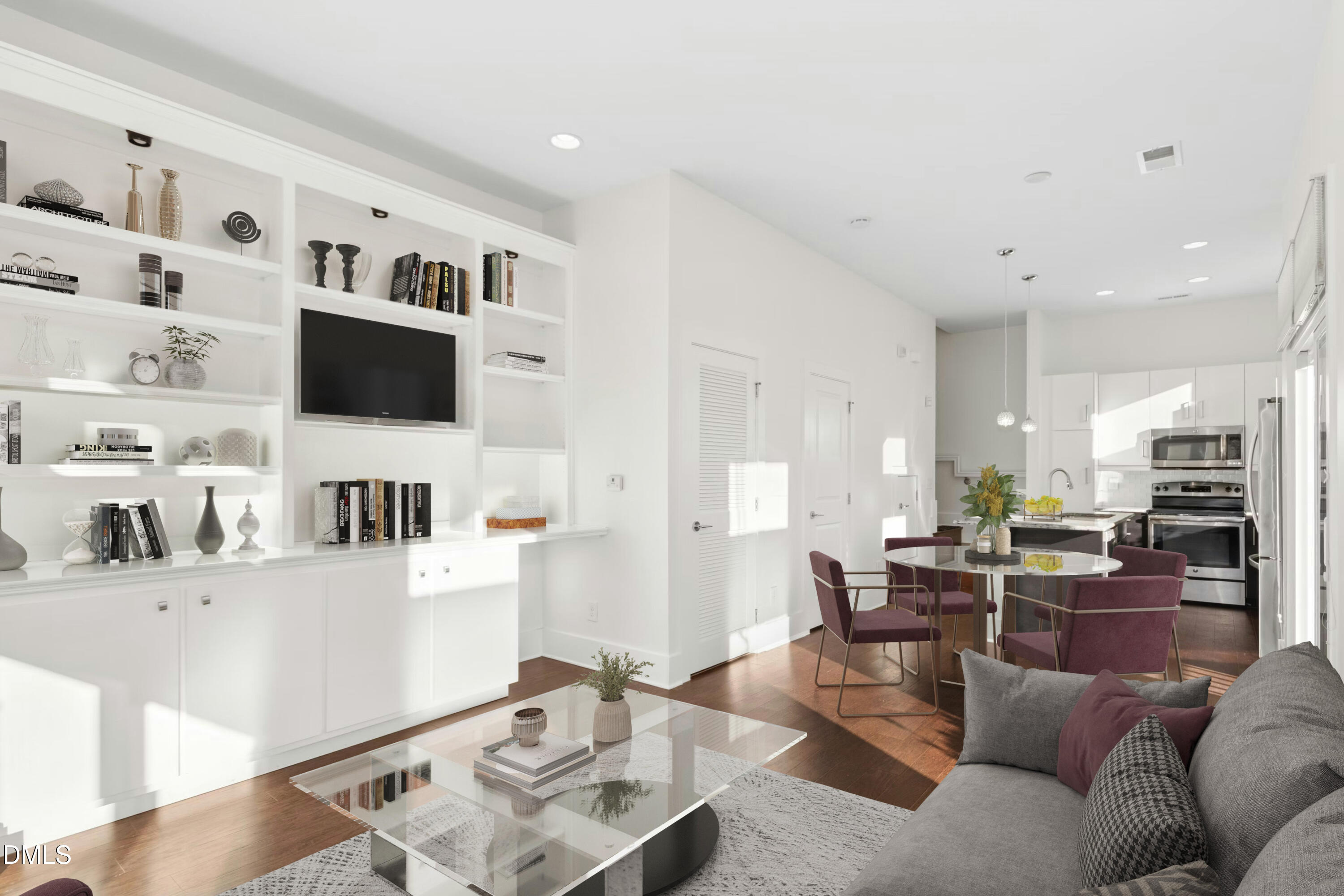 226 William Drummond Way Raleigh, NC 27604 - Photo 9 of 34 a living room with furniture a flat screen tv and kitchen view