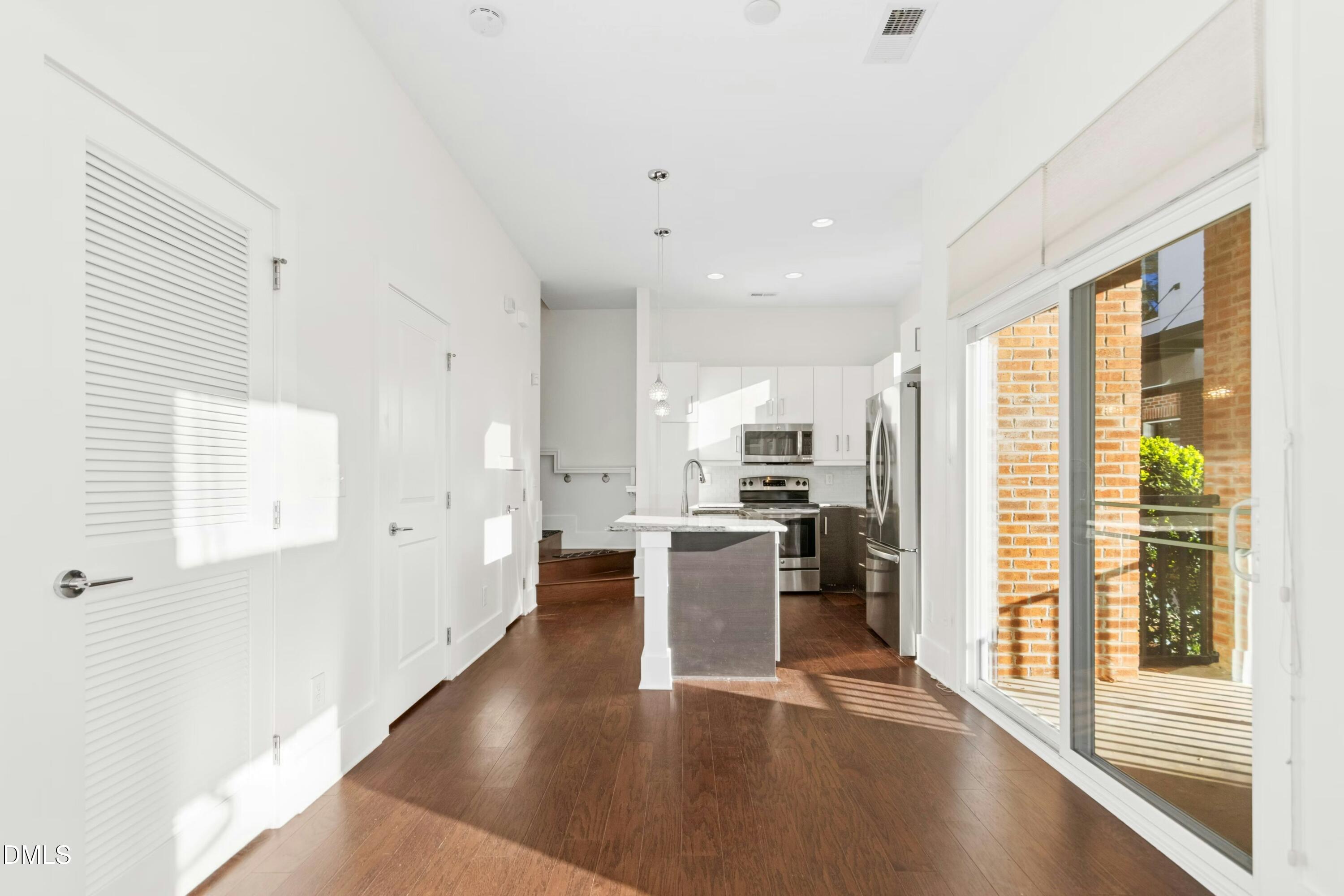 226 William Drummond Way Raleigh, NC 27604 - Photo 12 of 34 a view of a kitchen with furniture and wooden floor