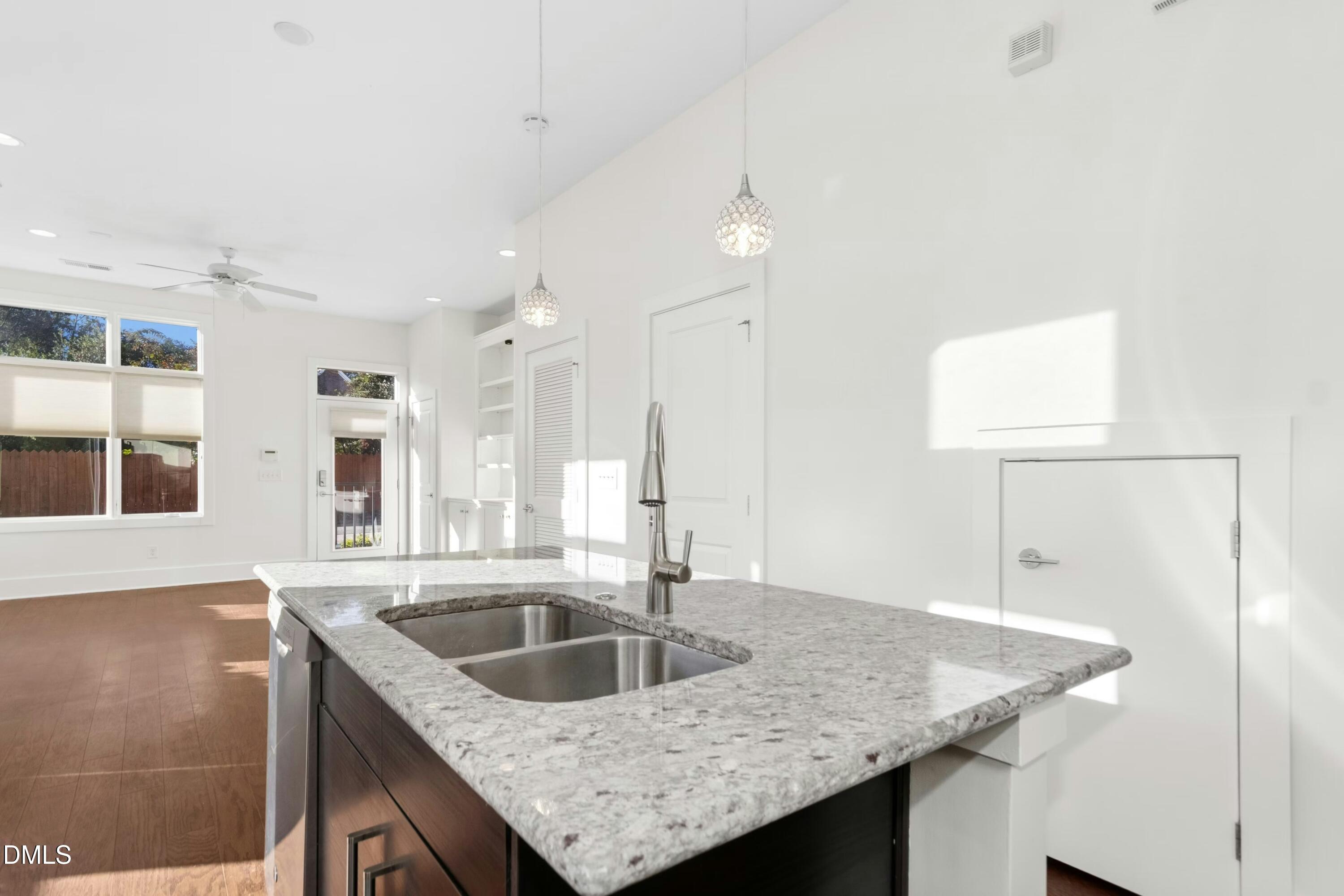 226 William Drummond Way Raleigh, NC 27604 - Photo 16 of 34 a kitchen with a sink a counter space and cabinets