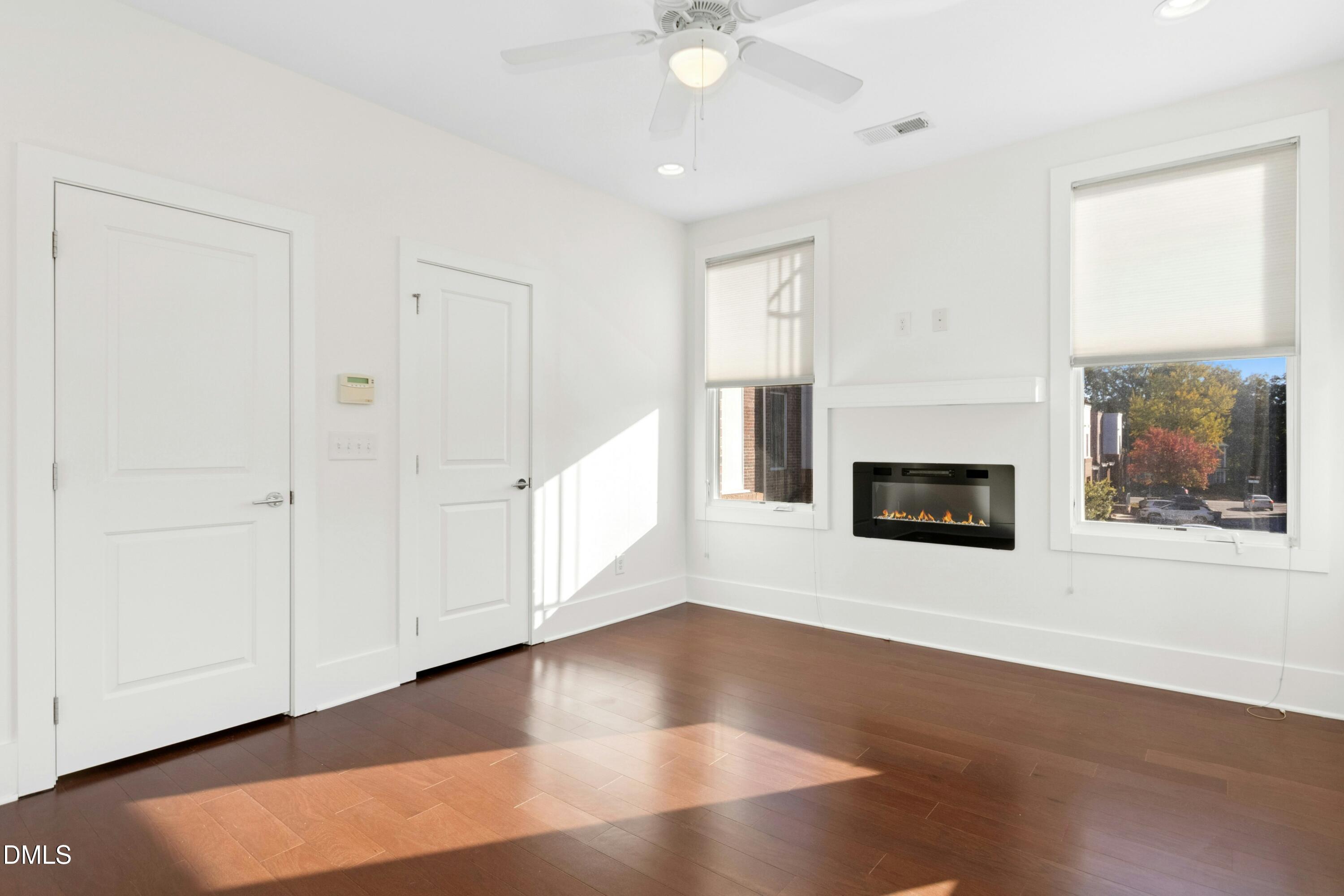 226 William Drummond Way Raleigh, NC 27604 - Photo 18 of 34 an empty room with windows and fireplace