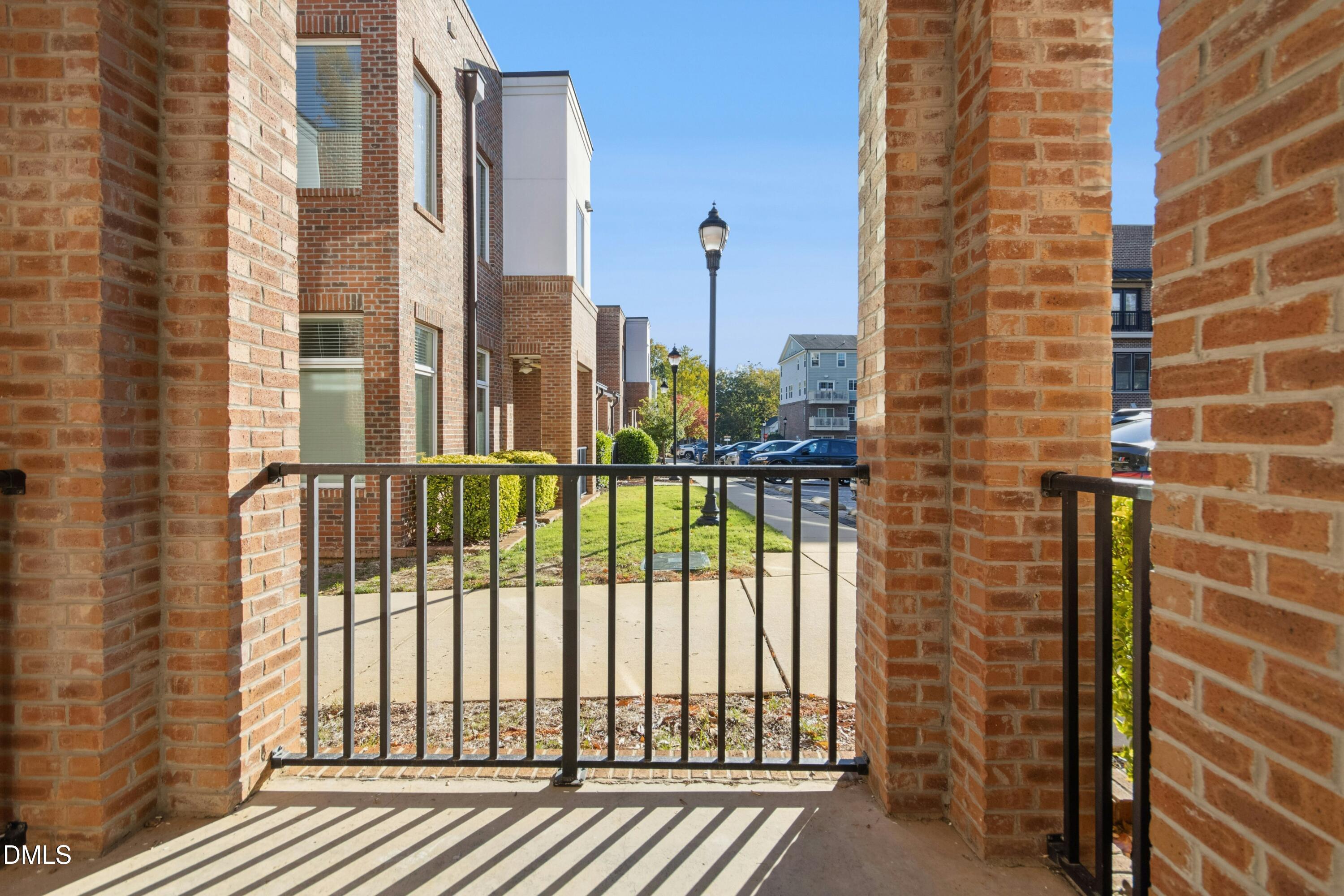 226 William Drummond Way Raleigh, NC 27604 - Photo 25 of 34 a view of a balcony with floor to ceiling windows