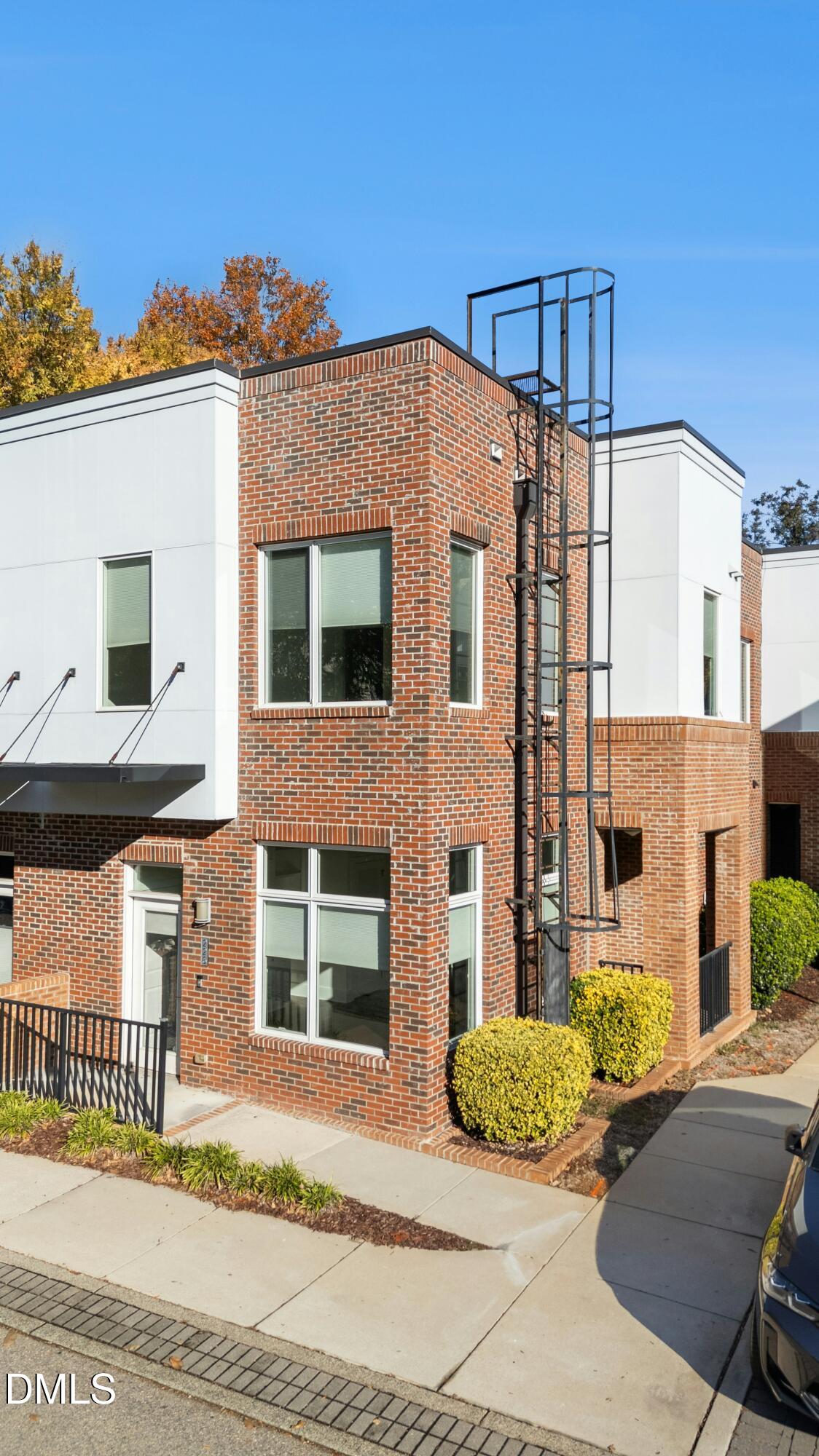 226 William Drummond Way Raleigh, NC 27604 - Photo 27 of 34 a view of a brick building next to a yard