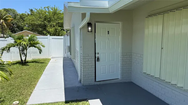 a view of a back yard from a room