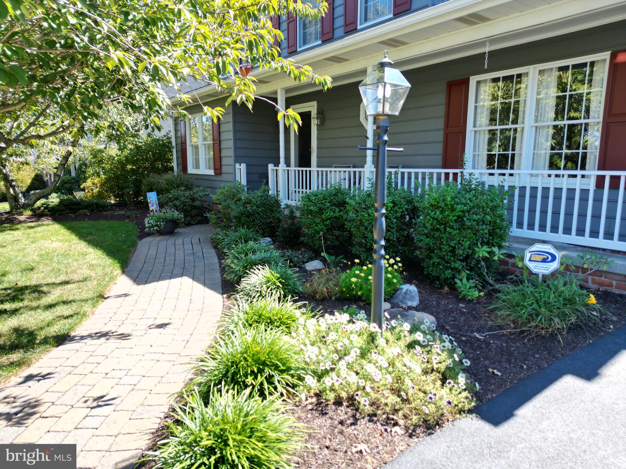 7133 Poole Jones Road Frederick, MD 21702 - Photo 5 of 67 Paver patio walkway to the front entrance