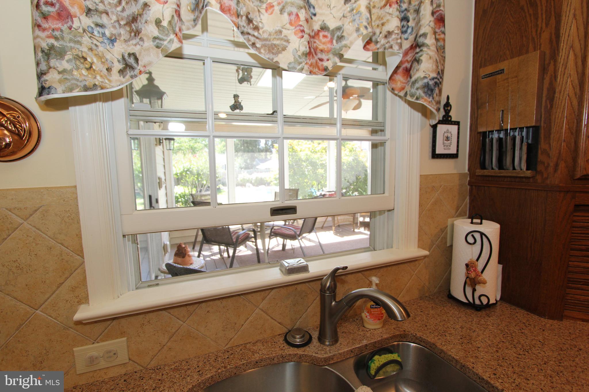 7133 Poole Jones Road Frederick, MD 21702 - Photo 10 of 67 Kitchen window overlooks the sun porch & pool