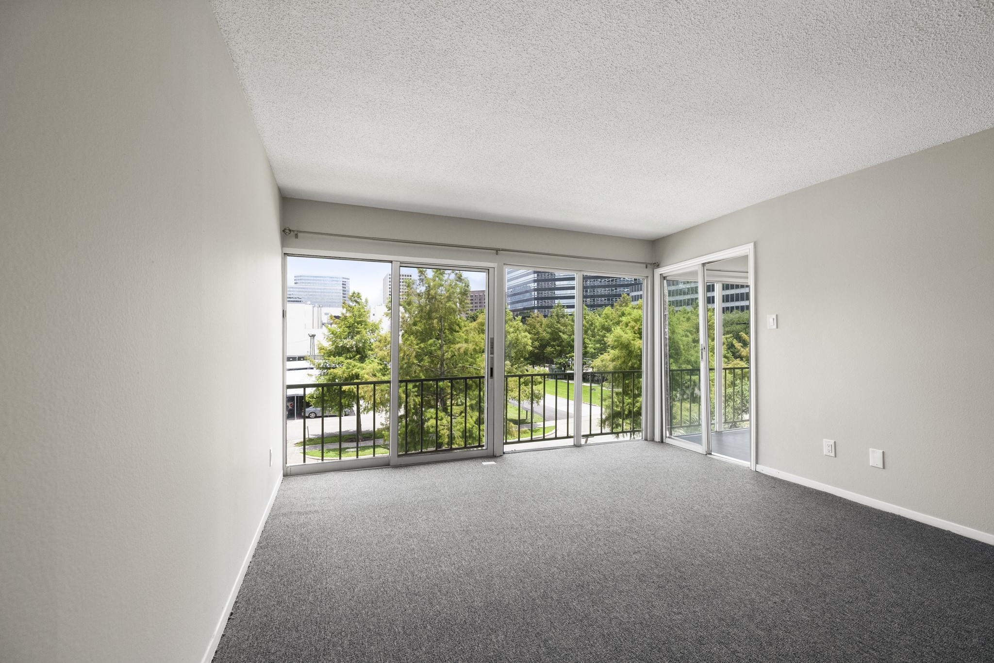 5050 Ambassador Way, Unit 316 Houston, TX 77056 - Photo 5 of 11 a view of a room with large windows