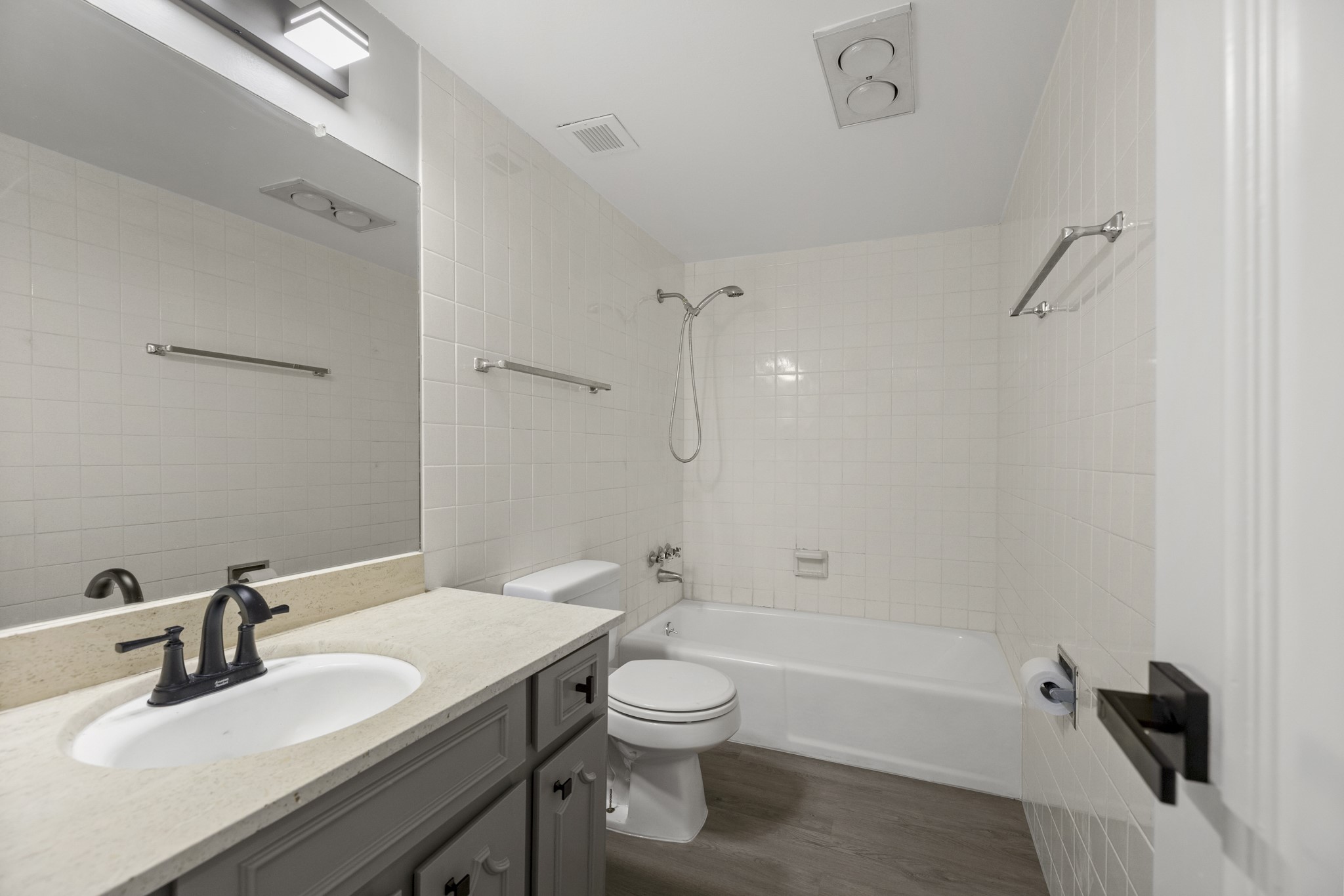 5050 Ambassador Way, Unit 316 Houston, TX 77056 - Photo 7 of 11 a bathroom with a sink toilet tub and shower