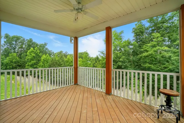 a view of balcony with wooden floor