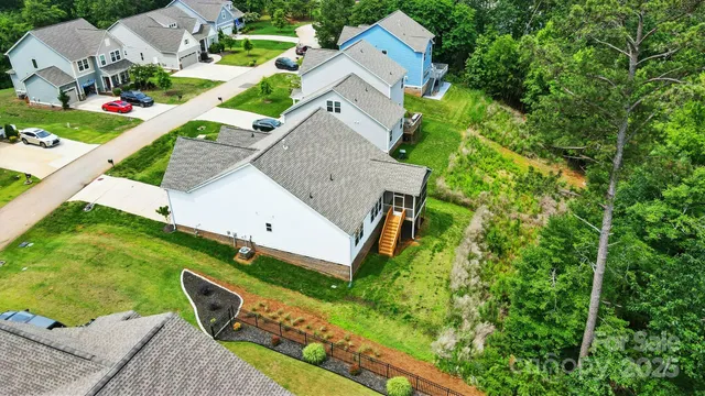 an aerial view of a house with a garden