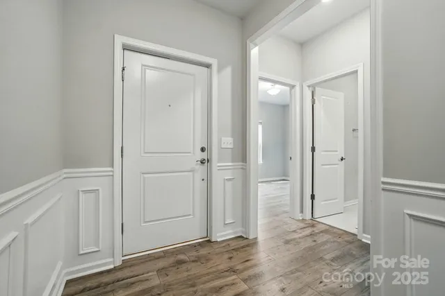 a view of a bathroom with wooden floor